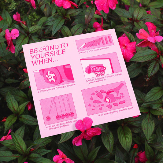 A pink self-care fine art print with the text "be kind to yourself" against floral background