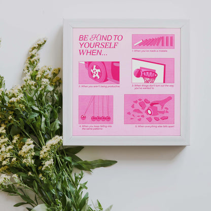 A framed 8x8" size pink self-care art print with the text "be kind to yourself" next to a bouquet of flowers