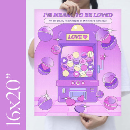 A girl holding an 16x20" size purple claw machine self-care art print with the text "i'm meant to be loved" 