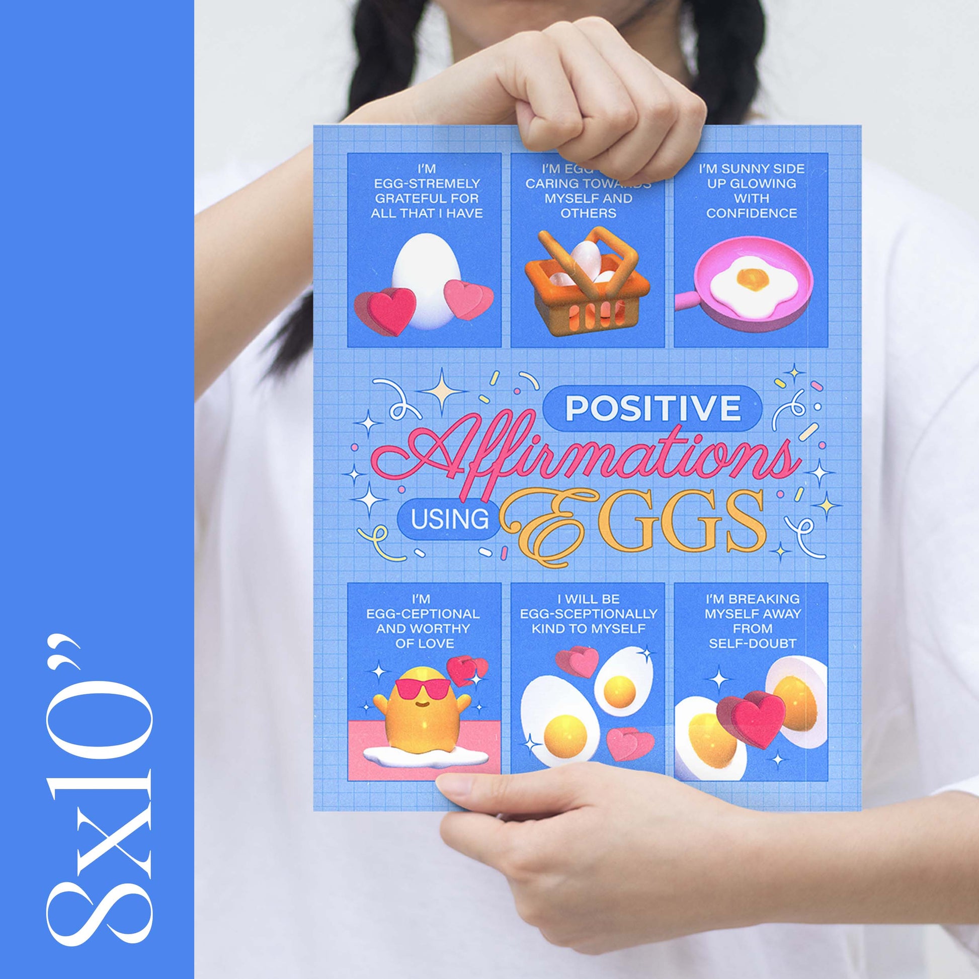 A girl holding an 8x10" size blue self-care art print with the text "positive affirmations using eggs"